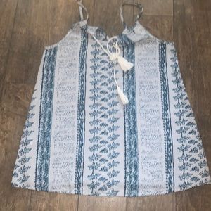 Blue tank top with tassel detail. Size Large. New without tags.